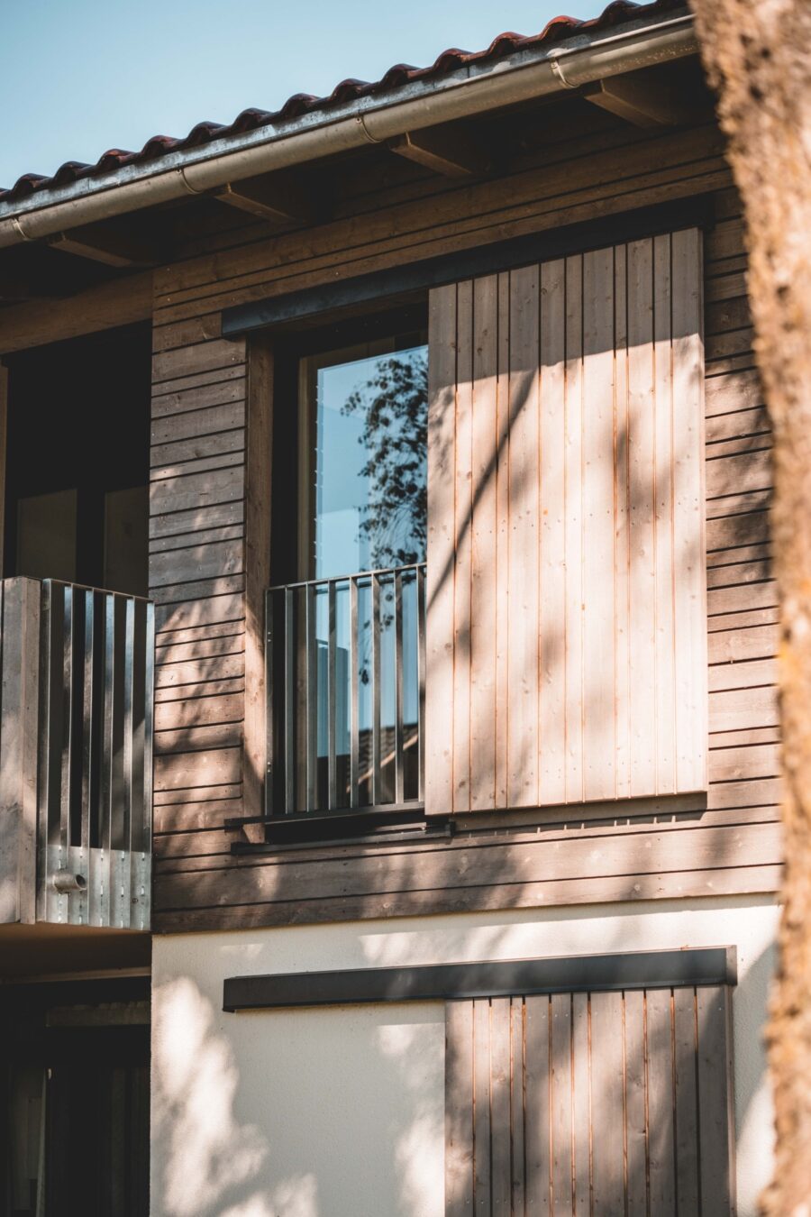 Blaesig Architekten Wohnungsbau Weihenlinden Fassade Fensterläden